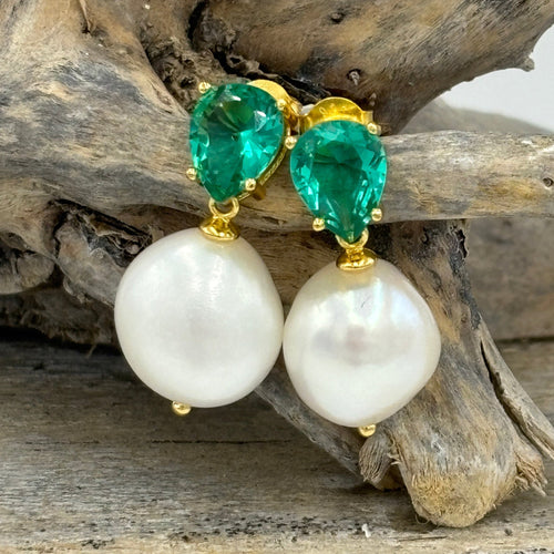 These fabulous stud style earrings are made of 18K gold plated 925 sterling silver. They feature a beautiful claw set aqua cubic zirconia with button white pearl.

The pearls measure 11-12mm.

The size from top to bottom is 25mm.