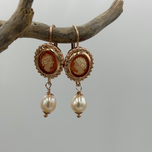 Unusual Pearl and Cameo 18K Rose gold plated over sterling silver hook earrings. The creamy white lustre of the drop pearls sit beautifully alongside the delicate cameo and rose gold highlights.