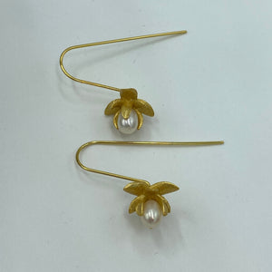 Satin finish 18k gold plated over 925 sterling silver hook style earrings  Featuring small White Drop shape pearls, 5 x 8mm in size, encapsulated in the orchid flower  Overall earring length of 30mm