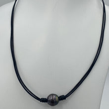 Load image into Gallery viewer, Double black leather necklet featuring a Dark Aubergine, Drop shape Tahitian South Sea Pearl 11.5mm in size. The color of this pearl is stunning and bright.

This pearl has High lustre and natural &#39;birthmarks&#39;.&nbsp;

The necklace is leather and has a silver Cartier clasp and is a rich Pindan in color.

The length is adjustable from 45 to 51cm using the extension chain

J3256

