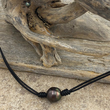 Load image into Gallery viewer,  Double black leather necklet featuring a Dark Aubergine, Drop shape Tahitian South Sea Pearl 11.5mm in size. The color of this pearl is stunning and bright.

This pearl has High lustre and natural &#39;birthmarks&#39;.&nbsp;

The necklace is leather and has a silver Cartier clasp and is a rich Pindan in color.

The length is adjustable from 45 to 51cm using the extension chain

J3256
