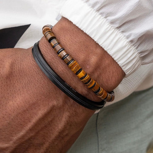 Brown Tiger's Eye 6mm semi precious stones with a 6mm Black slider 

Adjustable size

In stock now size M

Pictured below with 'Navarch' 

Also available in other colors and sizes 