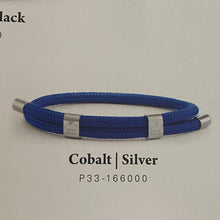 Load image into Gallery viewer, Stunning new range of Men&#39;s Stainless steel and nautical rope jewellery, hand made in Amsterdam and designed with strength to be worn 24/7

Cobalt Blue 6mm round rope and silver fittings

Adjustable size

In stock now in size S and M

Also available in other colors and sizes&nbsp;

