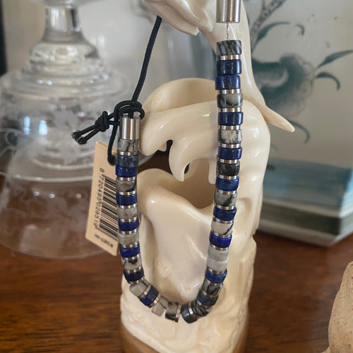 Stunning new range of Men's & Unisex Stainless steel and nautical rope jewellery, hand made in Amsterdam and designed with strength to be worn 24/7

Blue Lapis and Grey semi precious stones 6mm semi precious stones with a 6mm Silver slider 

Adjustable size

In stock now size M