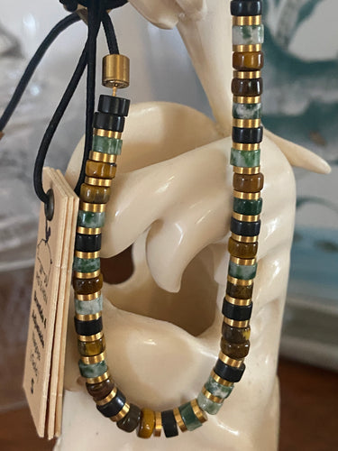 Stunning new range of Men's & Unisex Stainless steel and nautical rope jewellery, hand made in Amsterdam and designed with strength to be worn 24/7

Green, Brown and Black semi precious stones 4mm with a 4mm Gold slider 

Adjustable size

In stock now size S and M

Also available in other colors and sizes 