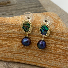 Load image into Gallery viewer, Hand crafted, stud style, gold plated over Sterling silver earrings that feature ornate bezel set blue green paua and 8mm round freshwater pearls that are black with blue hues.

Size in total is 24mm from top to bottom
