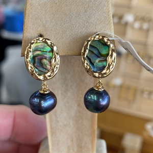 Hand crafted, stud style, gold plated over Sterling silver earrings that feature ornate bezel set blue green paua and 8mm round freshwater pearls that are black with blue hues.

Size in total is 24mm from top to bottom