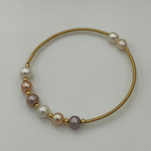 14ct Gold plated Sterling silver wire wrap bracelet featuring a mix of 6 natural white, pink and lavender hue freshwater pearls, round shaped, 7mm in size and 2 smaller white pearls 5.9mm on ends.