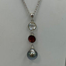 Load image into Gallery viewer, This pendant features an 8mm facetted garnet, clear quartz and a Tahitian South Sea Pearl. The pearl is  Drop in shape and 10.1mm in size and a Pale Peacock Green with pink hues in color. It is crafted from 925 Sterling silver  J3258
