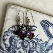 Load image into Gallery viewer, Sterling Silver Shepherds Hook featuring a White button shape 6mm Freshwater Pearl and a tear drop faceted Purple Amethyst and Oval shape Moonstone above  Total length of earring from top to bottom is 42mm. 
