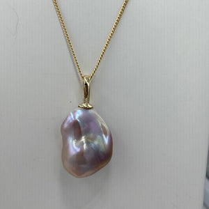 'Kitzu' is a stunning large&nbsp; Baroque Freshwater Edison Pearl set in a 9ct yellow&nbsp; Gold pendant which can be worn on any chain.

This large pearl is 18 mm wide and&nbsp; 25mm high with&nbsp; beautiful lustre and a deep natural lavender and pink coloration