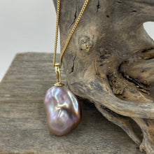 Load image into Gallery viewer, &#39;Kitzu&#39; is a stunning large&nbsp; Baroque Freshwater Edison Pearl set in a 9ct yellow&nbsp; Gold pendant which can be worn on any chain.

This large pearl is 18 mm wide and&nbsp; 25mm high with&nbsp; beautiful lustre and a deep natural lavender and pink coloration
