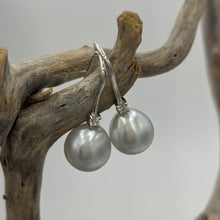 Load image into Gallery viewer, Australian South Sea Pearl earrings on 925 sterling silver shepherd hooks set with Cubic Zirconia  They feature Semi Baroque shaped pearls,&nbsp; 11mm x 12mm in size and White with silver and pink hues in colour.  High lustre  J3461
