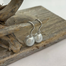 Load image into Gallery viewer, Australian South Sea Pearl earrings on 925 sterling silver shepherd hooks set with Cubic Zirconia  They feature Semi Baroque shaped pearls,&nbsp; 11mm x 12mm in size and White with silver and pink hues in colour.  High lustre  J3461
