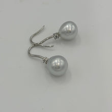 Load image into Gallery viewer, Australian South Sea Pearl earrings on 925 sterling silver shepherd hooks set with Cubic Zirconia  They feature Semi Baroque shaped pearls,&nbsp; 11mm x 12mm in size and White with silver and pink hues in colour.  High lustre  J3461
