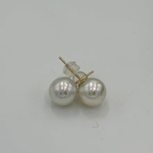 Load image into Gallery viewer, Australian South sea pearl studs set in 9ct yellow gold with butterflies also in 9ct These earrings feature 9.1mm, Round pearls, AA grade with Excellent lustre&nbsp;  White with silver Pink hues in color  JSP
