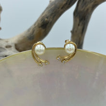 Load image into Gallery viewer, These delicate 9ct Yellow Gold and Diamond stud style earrings feature&nbsp; Akoya button shape pearls that are champagne in color  The &#39;comet design features 4 diamonds...
