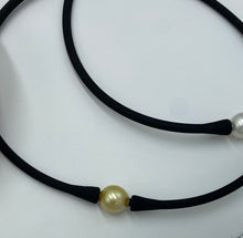 Load image into Gallery viewer, Silicone necklace featuring interchangeable Golden South Sea pearl, Oval  in shape, 11.8 x 12.5mm in size and Dark Gold in colour  This pearl comes with the black necklace band unless you specify an alternative  If you prefer a bracelet band you can choose black.  OR if you prefer a  coloured bracelet bands when you order - select coloured and specify which color in the notes   Please see &quot;Silicone bracelets (band only)&quot; for the colors available  J3271
