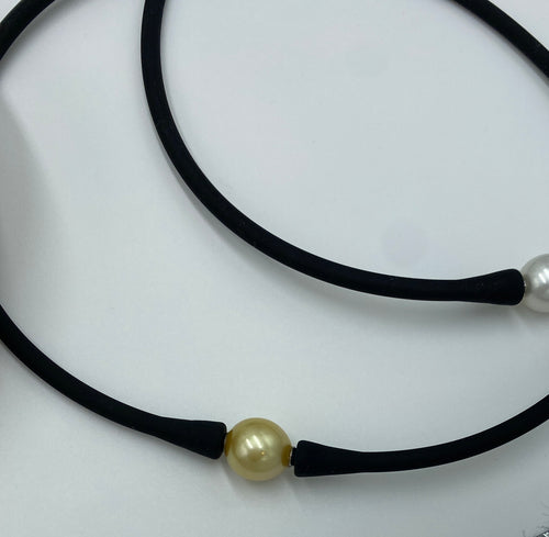 Silicone necklace featuring interchangeable Golden South Sea pearl, Oval  in shape, 11.8 x 12.5mm in size and Dark Gold in colour  This pearl comes with the black necklace band unless you specify an alternative  If you prefer a bracelet band you can choose black.  OR if you prefer a  coloured bracelet bands when you order - select coloured and specify which color in the notes   Please see 