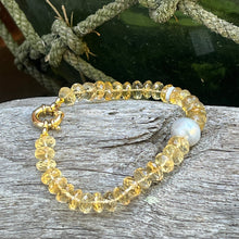 Load image into Gallery viewer, &lt;p&gt;Citrine bracelet featuring a white Australian South Sea Pearl&lt;/p&gt; &lt;p&gt;Pearl is a button shape, and is 11.8mm in size and is white with silver pink hues in colour&lt;/p&gt; &lt;p&gt;The Citrine beads are facetted button shaped and are 8.5 x 3.5mm in size&lt;/p&gt; &lt;p&gt;This bracelet is knotted with a gold plated over sterling silver bolt ring clasp&lt;/p&gt; &lt;p&gt;J3362&lt;/p&gt;
