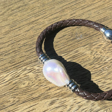 Load image into Gallery viewer, &lt;p&gt;&#39;Pam DB&#39; is a braided leather bracelet featuring a white Baroque Freshwater Pearl&lt;/p&gt; &lt;p&gt;The pearl is baroque shape, 20 x 22mm in size and is white with silver hues in colour&lt;/p&gt; &lt;p&gt;This bracelet is made out of braided dark brown leather and a stainless steel magnetic clasp&lt;/p&gt;

