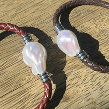 Load image into Gallery viewer, &lt;p&gt;&#39;Pam B&#39; is a braided leather bracelet featuring a white Baroque Freshwater Pearl&lt;/p&gt; &lt;p&gt;The pearl is baroque shape, 20 x 25mm in size and is white with pink hues in colour&lt;/p&gt; &lt;p&gt;This bracelet is made out of braided brown leather and a stainless steel magnetic clasp&lt;/p&gt;
