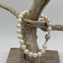 Load image into Gallery viewer, Stunning Akoya pearl strand bracelet, high lustre, and white with pink hues in color  This bracelet features twenty three round pearls, 7mm- 7.5mm,&nbsp; with a 9ct white gold traditional ball clasp.  It is 19cm including the clasp  J3396
