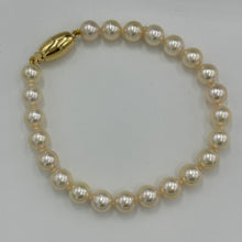 Load image into Gallery viewer, Timeless and Classic bracelet featuring stunning Acoya Sea pearls.  This bracelet features twenty three round pearls, 7mm- 7.5mm,&nbsp; with an 18ct yellow gold magnetic clasp.
