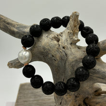 Load image into Gallery viewer, This dramatic stretch bracelet features a stunning white Australian South Sea Pearl.  The Pearl is a Drop, 11.1mm in size and is white with silver hues in colour.  The Black Lava beads highlight the lustre of the pearl.  J3467
