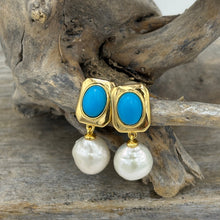 Load image into Gallery viewer, The &#39;Blue Light&#39; Drop Studs are crafted from 18K gold-plated 925 sterling silver, featuring a striking combination of freshwater pearls and vibrant turquoise accents.

Pearls measure 11mm.

Total length 26mm.
