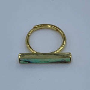 18K gold plated sterling silver with bezel set New Zealand Blue Green Paua shell inlay.  The finish is polished and this ring is adjustable in size.