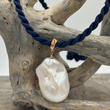 Load image into Gallery viewer, &#39;Kitza&#39; is a stunning large&nbsp; Baroque Freshwater Pearl set in a 9ct Rose Gold enhancer pendant which can be worn on any chain or strand.  This large pearl is 20mm wide and&nbsp; 30mm high with&nbsp; beautiful lustre.  The Pendant is displayed here on a Dark Blue Silk cord, sold separately for $25.
