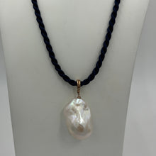 Load image into Gallery viewer, &#39;Kitza&#39; is a stunning large&nbsp; Baroque Freshwater Pearl set in a 9ct Rose Gold enhancer pendant which can be worn on any chain or strand.  This large pearl is 20mm wide and&nbsp; 30mm high with&nbsp; beautiful lustre.  The Pendant is displayed here on a Dark Blue Silk cord, sold separately for $25.
