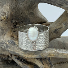 Load image into Gallery viewer, Sterling Silver, textured wide band Ring featuring an offset white mabe/ blister pearl.  The pearl is bezel set and is 8 x 10mm in size  Size 11 only available
