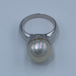 Sterling Silver 'chunky' style ring featuring a beautiful Baroque 13.7mm White Freshwater Pearl held safely inside the large cup.  It is rhodium coated for a non tarnish finish.  One size only 62