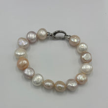 Load image into Gallery viewer, Freshwater pearl bracelet featuring natural pink and white potato shaped pearls, 10 x 13mm in size, with a modern Sterling Silver clasp.  Length including clasp is 20cm
