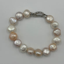 Load image into Gallery viewer, Freshwater pearl bracelet featuring natural pink and white potato shaped pearls, 10 x 13mm in size, with a modern Sterling Silver clasp.  Length including clasp is 20cm
