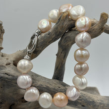 Load image into Gallery viewer, Freshwater pearl bracelet featuring natural pink and white potato shaped pearls, 10 x 13mm in size, with a modern Sterling Silver clasp.  Length including clasp is 20cm
