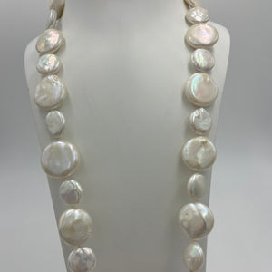 This exceptional quality Long White seedless Coin Freshwater pearl strand features a mix of 15mm and 21mm pearls of high lustre and white with cream hues in color.  It is fully knotted with a strong 10mm magnetic&nbsp; Gold Plated sterling silver clasp.&nbsp;  The length including clasp is 72cm.  SH469