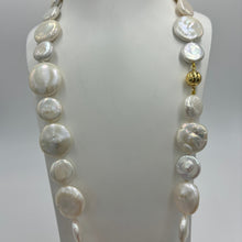 Load image into Gallery viewer, This exceptional quality Long White seedless Coin Freshwater pearl strand features a mix of 15mm and 21mm pearls of high lustre and white with cream hues in color.  It is fully knotted with a strong 10mm magnetic&nbsp; Gold Plated sterling silver clasp.&nbsp;  The length including clasp is 72cm.  SH469
