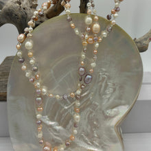 Load image into Gallery viewer, This elegant and versatile necklace is 1.2m long and can be worn in many ways.  It features mixed pearls of natural color and shapes,&nbsp; ranging in size from 3 to 8mm.  The colors range from white, pink and lavender.
