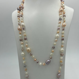 This elegant and versatile necklace is 1.2m long and can be worn in many ways.  It features mixed pearls of natural color and shapes,&nbsp; ranging in size from 3 to 8mm.  The colors range from white, pink and lavender.