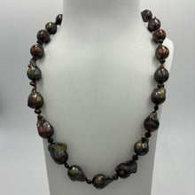 Load image into Gallery viewer, This baroque shape Freshwater Pearl strand/necklace features decadent large 12 x18mm chocolate pearls with rainbow hues,&nbsp; separated with little 3mm &#39;keshi&#39; pearls.  It is fully knotted and features a &#39;chanel&#39;&#39; clasp.&nbsp;  The length including clasp is 53cm.
