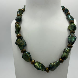 An unusual and stunning Freshwater Baroque Pearl necklace/strand featuring bottle Green color pearls, 15 x 22mm in size, set in amongst Bronze beads with a Gold Plated T-bar clasp.  Length including clasp is 46cm  SH468