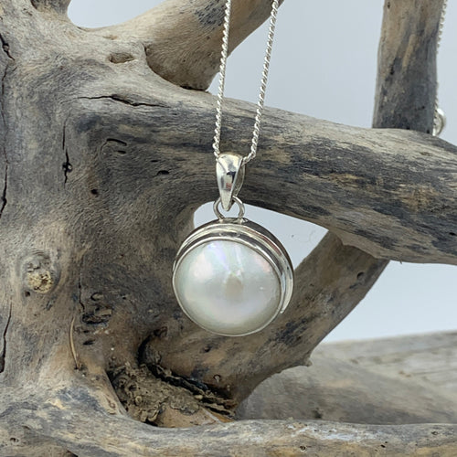 Stunning 925 Sterling silver, bezel set Mabe  pearl pendant, round in shape, beautiful white with silver hues in color and 17.5mm in size.