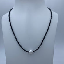 Load image into Gallery viewer, Classical! An Australian South Sea pearl necklace with 2mm faceted Black Spinel gemstones and a sterling silver peanut clasp.

This necklace features a Round 8.8mm pearl, White with silver hues.

The necklace measures 45cm including the clasp..

J3370
