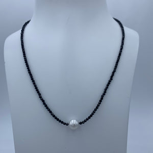 Classical! An Australian South Sea pearl necklace with 2mm faceted Black Spinel gemstones and a sterling silver peanut clasp.

This necklace features a Round 8.8mm pearl, White with silver hues.

The necklace measures 45cm including the clasp..

J3370