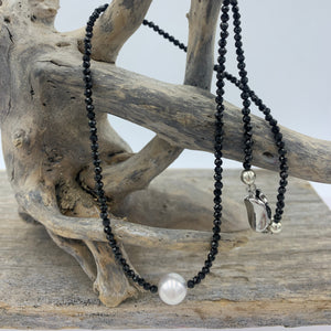 Classical! An Australian South Sea pearl necklace with 2mm faceted Black Spinel gemstones and a sterling silver peanut clasp.

This necklace features a Round 8.8mm pearl, White with silver hues.

The necklace measures 45cm including the clasp..

J3370