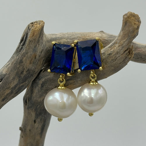 These fabulous earrings feature beautiful blue crystals,  rectangle in shape and 8 x 10mm in size.  They are made of 18K gold plated  925 sterling silver stud style earrings and  feature 10mm Drop  White Freshwater pearls.  The size from top to bottom is 25mm