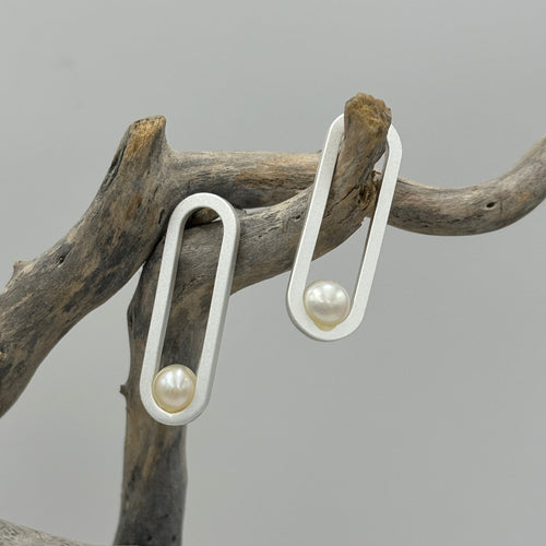 These satin finish Sterling silver stud style hoop earrings feature 5.5 -6mm White Freshwater pearls.   Overall earring length of 30mm.  They are also available in 18ct gold plating over 925 sterling silver.